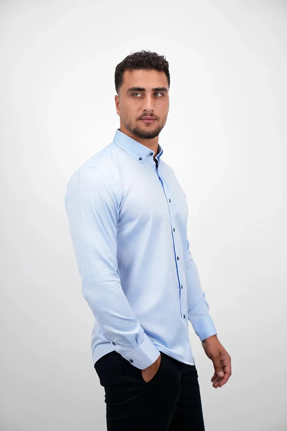 Blue Long Sleeved Shirt With Black Button To Close